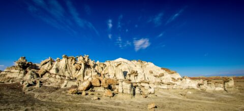 Big White Rock Surrounded With Hoodoos And Flat Tops in Bisti Wilderness, NM
