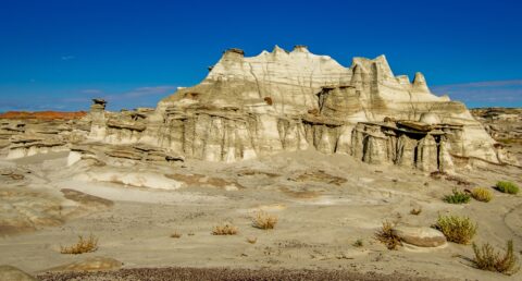 Big White Rock With Hoodoo And Flat Tops In Bisti Wilderness, NM