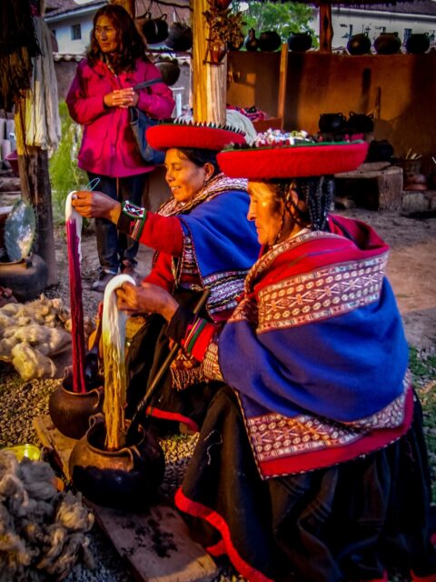 Quechua women coloring wool with natural dyes, Chinchero, Sacred Valley, Peru