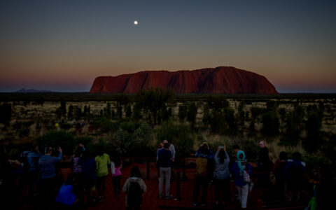 Photographers And Visitors On Uluru Sunrise Point, NT, Australia