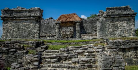 Mayan Ruins and Obelisk with Straw Roof In Tulum Archaeological Site, Quintana Roo, Mexico
