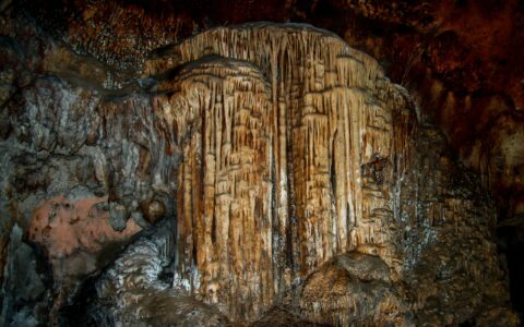 Stone waterfall formations In Lol-Tun Caves In Yucatan, Mexico