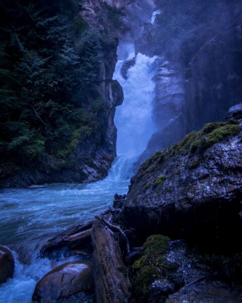 In the Freezing Mist of the Bear Creek Falls near Highway 1, Glacier National Park, BC