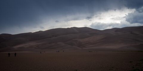 Visitors Leaving Sand Dunes Before Afternoon Storm In Great Sand Dunes National Park, CO