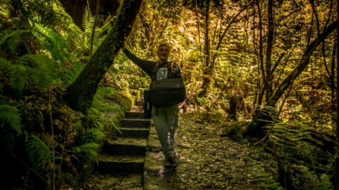 rrasha Rests In The Shadow Carrying Photo Gear  On The Way Up In Grand Canyon Trail, Blue Mountains, NSW, Australia