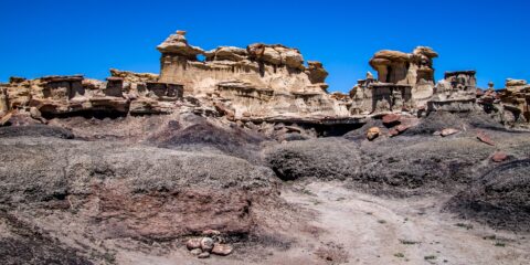 Climbing Towards Toadstools And Hoodoos at Distant End of Valley Of Dreams, NM