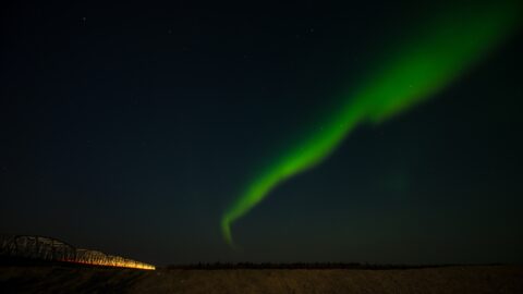 Aurora Borealis And Car Light Trail On Gestle River Black Heroes Memorial Bridge, AK