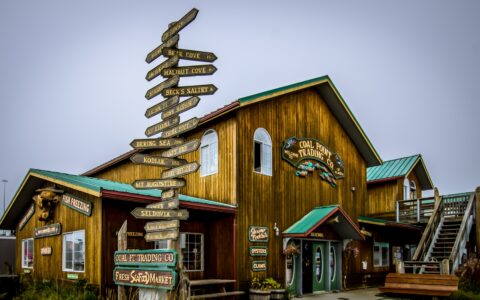 Direction Sign Near Coal Point Trading Co. In Homer, AK