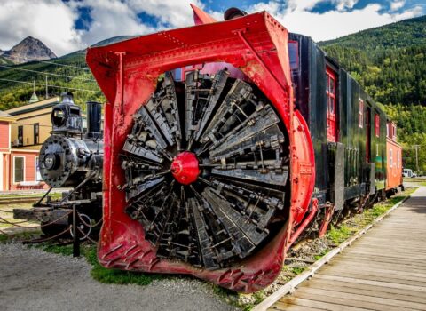 Display Of Snow Removal Machine And Steam Locomotive In Skagway, AK