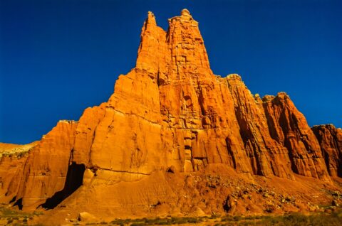 Giant Monolith Under Burning Sun In Upper Cathedral Valley, UT