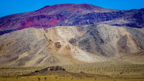 Violet-Red Colored Hill In Death Valley National Park, CA