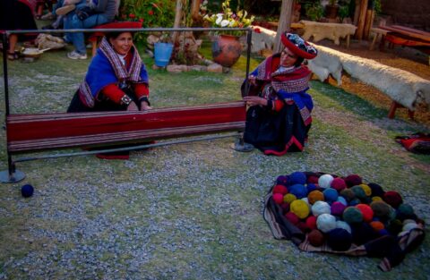 Quechua women prepare wool for manual weaving, Chinchero, Sacred Valley, Peru