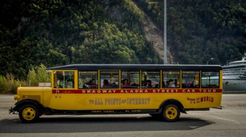 Tourists From Big Cruiser On The Street Tour In Skagway, AK