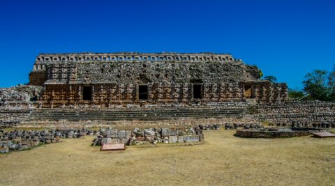 In Front Of The Mayan Building In Kabah Archaeological Site In Yucatan, Mexico