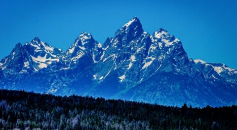 Look From Distance At Mountains And Glaciers In Grand Teton National Park, WY