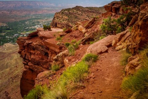 Rock On The Road And 70m High Cliff, But Bicyclists Still Do Not Dismount On Portal Trail, Moab, UT